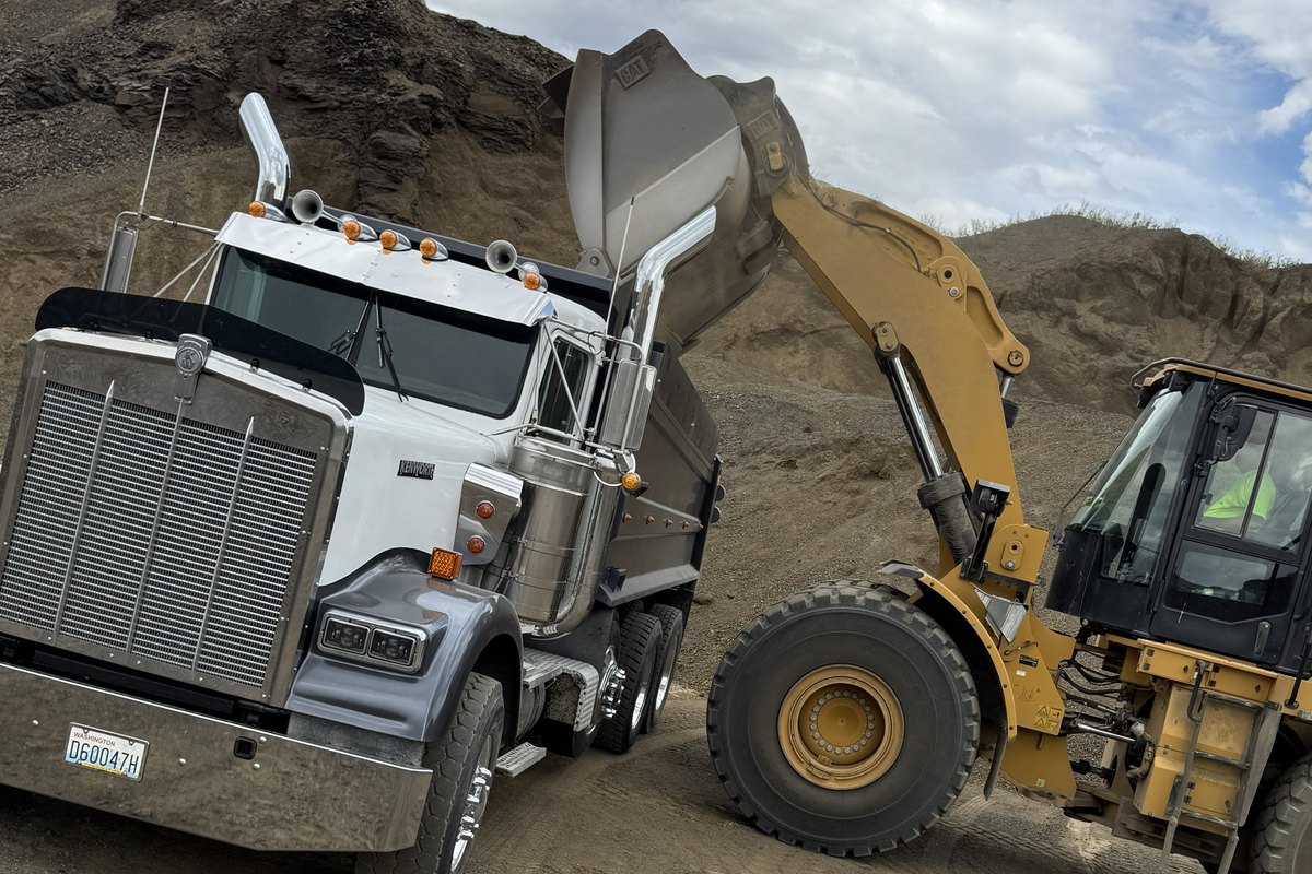 Wheel loader loading a Basalt Kenworth dump truck from a stockpile